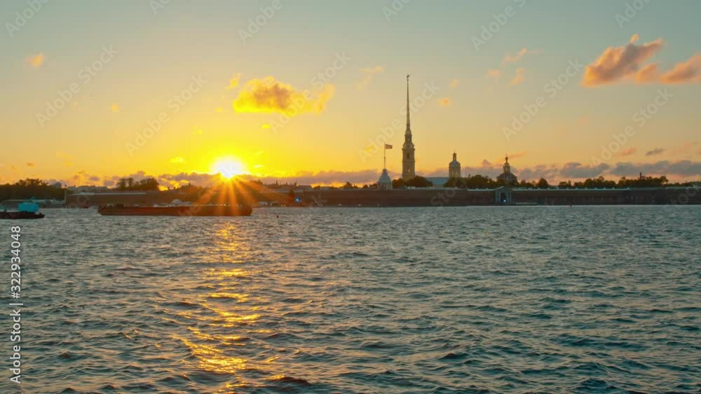 Beautiful sunset on the background of the Peter and Paul Fortress on the Neva River. St. Petersburg, Russia. Beautiful sunset on the background of the Peter and Paul Fortress on the Neva River. St. Petersburg, Russia.