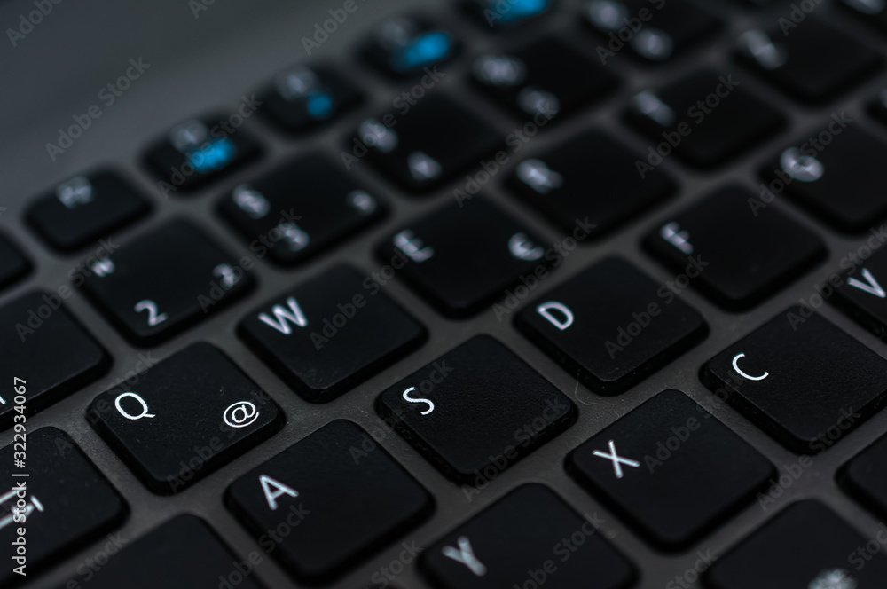 Photo macro digital keyboard computer for business on the dark and little light Photo macro digital keyboard computer for business on the dark and little light