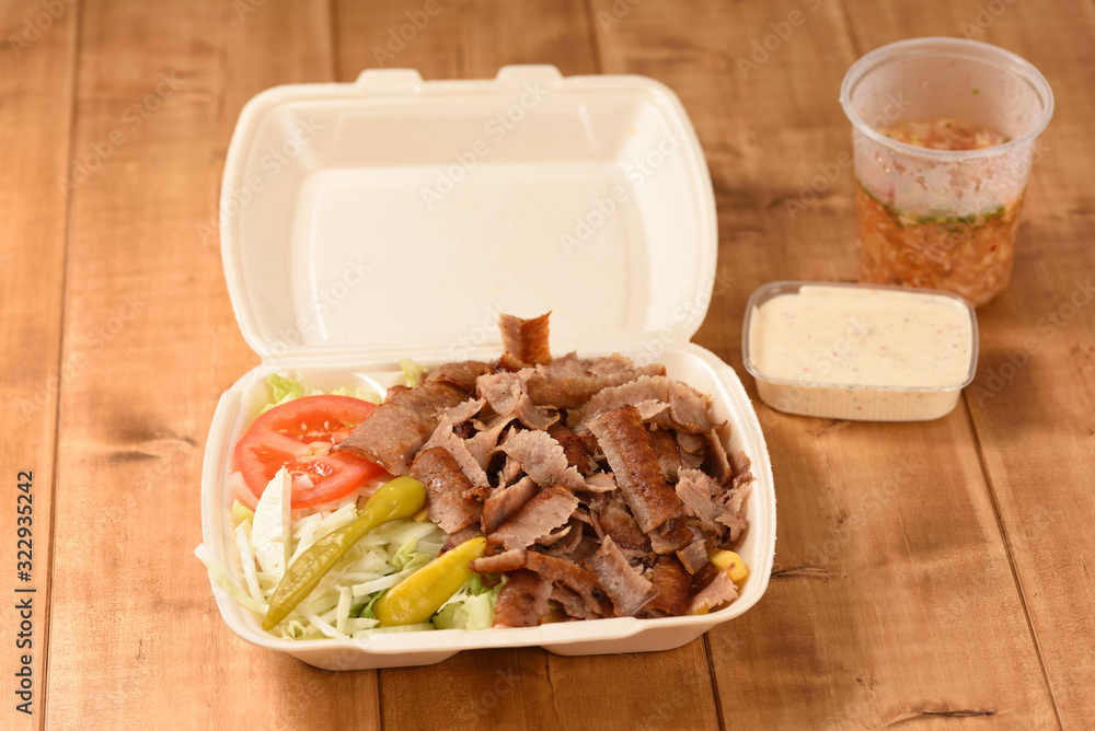 delivered fast food doner in a plastic box delivered fast food doner in a plastic box