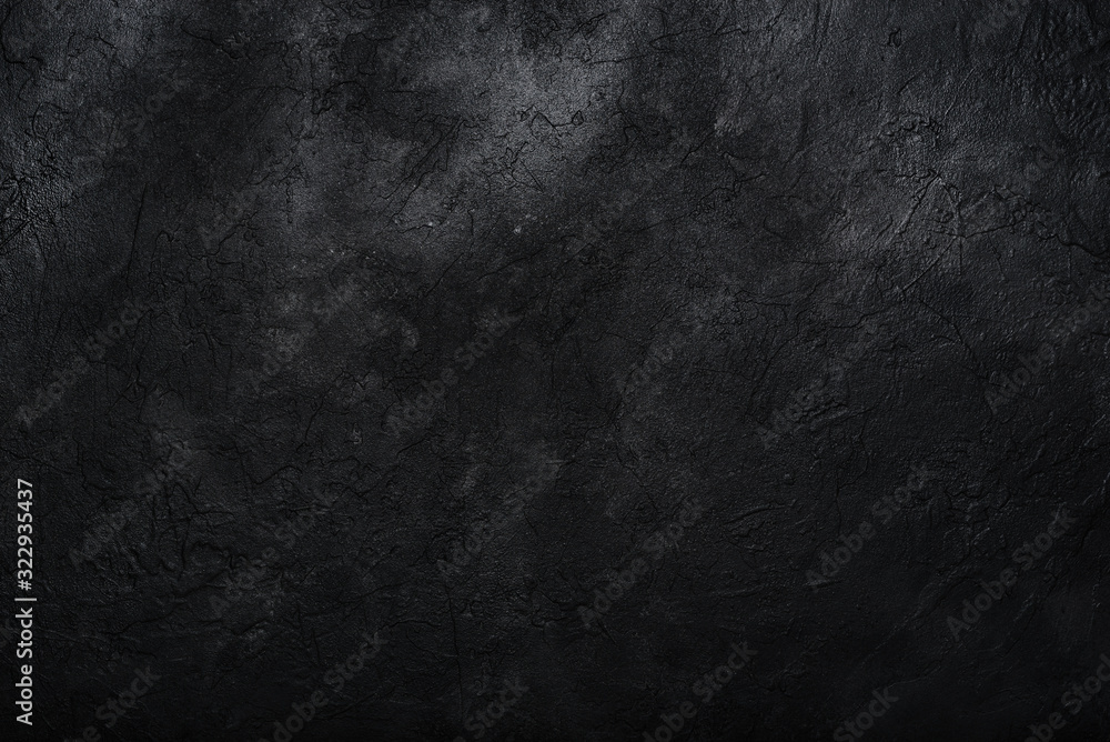 Dark textured concrete wall background. Copy space
