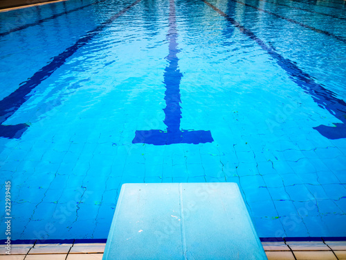 Fotografie View of starting blocks and lanes in a public swimming pool