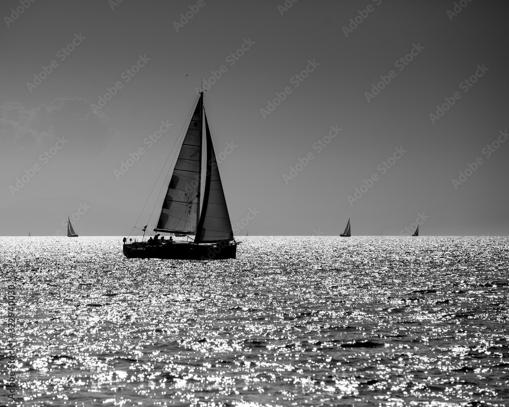 Black and white yacht silhouette in the high sea
