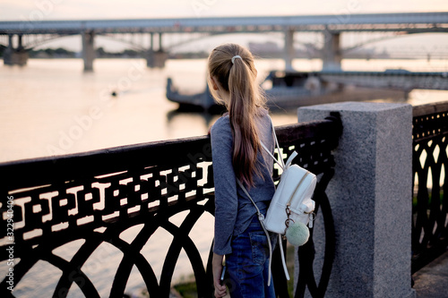 Wallpaper Mural Teen girl on the promenade at sunset Torontodigital.ca