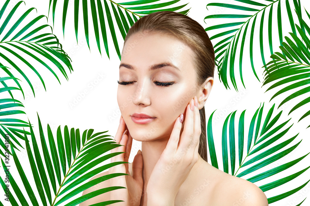 Beautiful woman with smooth skin in tropical green palm leaves. Beautiful woman with smooth skin in tropical green palm leaves.