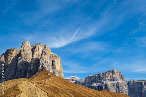 Autumn alpine Dolomites mountain scene  Sudtirol  Italy. Peaceful view near Sella Pass. Picturesque traveling  seasonal  nature and countryside beauty concept scene.