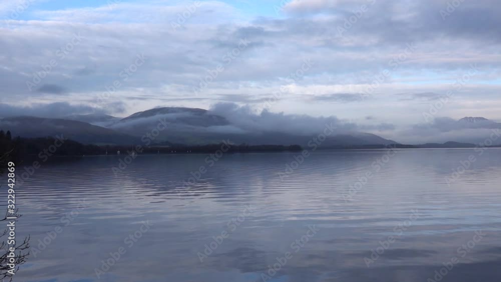 Calm waters of Loch Lomond in Scotland at Sunrise Calm waters of Loch Lomond in Scotland at Sunrise