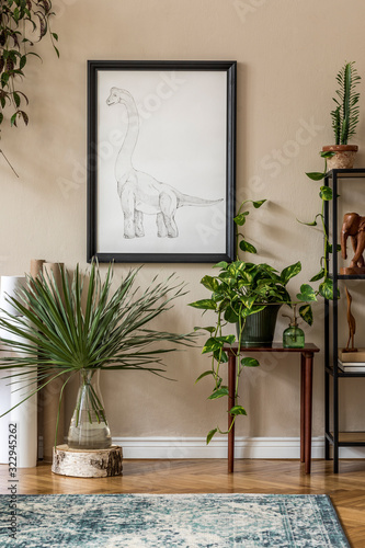 Stylish retro home staging of living room with black mock up poster frame, design furnitures, a lot of plants, cacti, carpet, maps and elegant personal accessories. Vintage home decor. Template. 