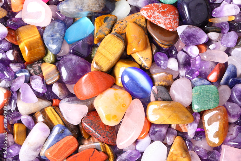 Collection of small semiprecious gemstones. Background image. Collection of small semiprecious gemstones. Background image.