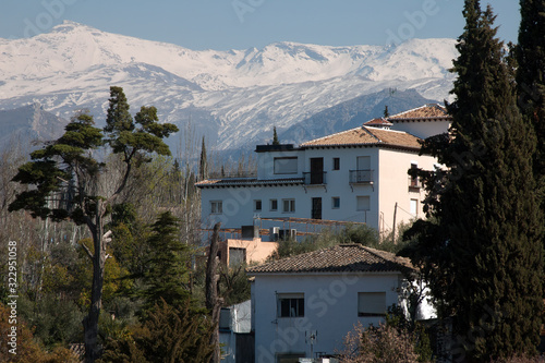 Granada Spain, house with Sierra Nevada mountains in the background © KarinD