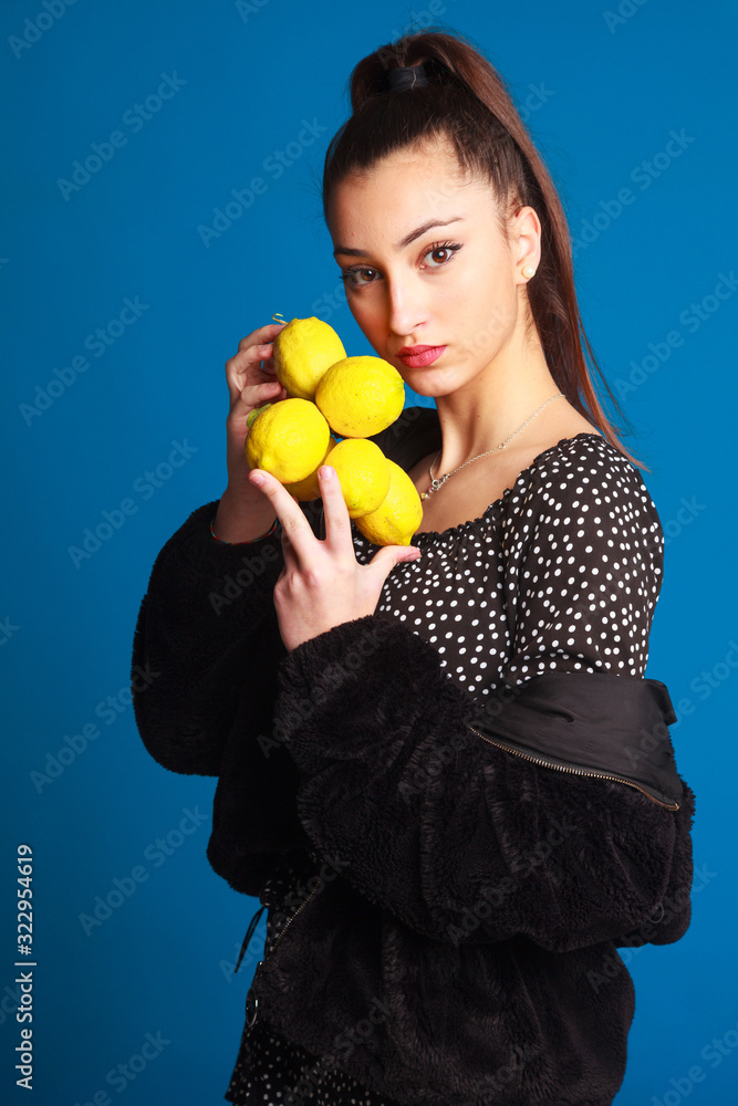 Young, beautiful and elegant girl on studio plain background Young, beautiful and elegant girl on studio plain background