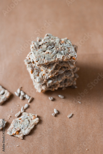 Crunchy crispbread on a brown background, cereal flax seed ,sunflower seeds protein bread bar