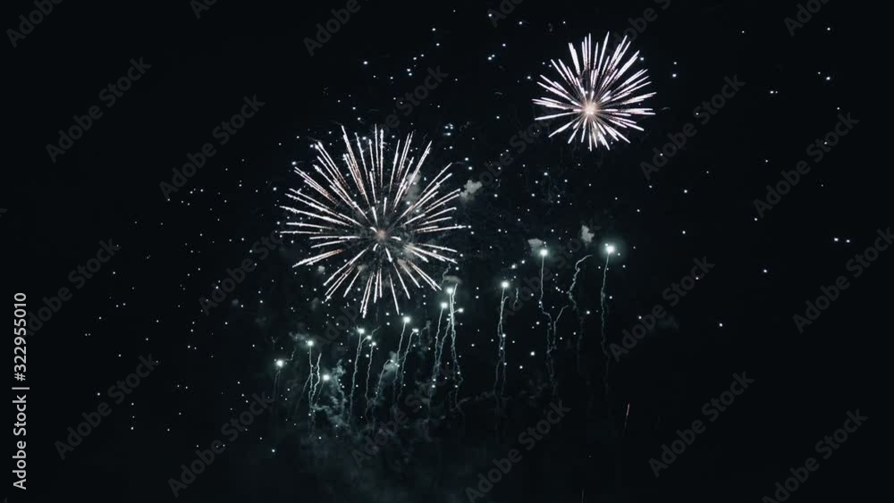 Beautiful fireworks in the night sky. Pyrotechnic performance fireworks, firecrackers, fires and explosions.Festival Celebration Event Carnival Parade.Romantic date.Golden shining with bokeh 4K. Beautiful fireworks in the night sky. Pyrotechnic performance fireworks, firecrackers, fires and explosions.Festival Celebration Event Carnival Parade.Romantic date.Golden shining with bokeh 4K.