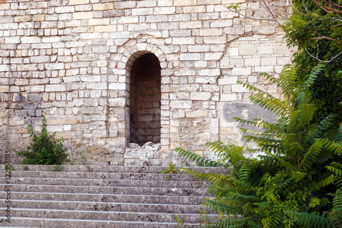 Fototapeta Naklejka Na Ścianę i Meble -  Entrance doors in the wall of the old house. Kerch, Crimea
