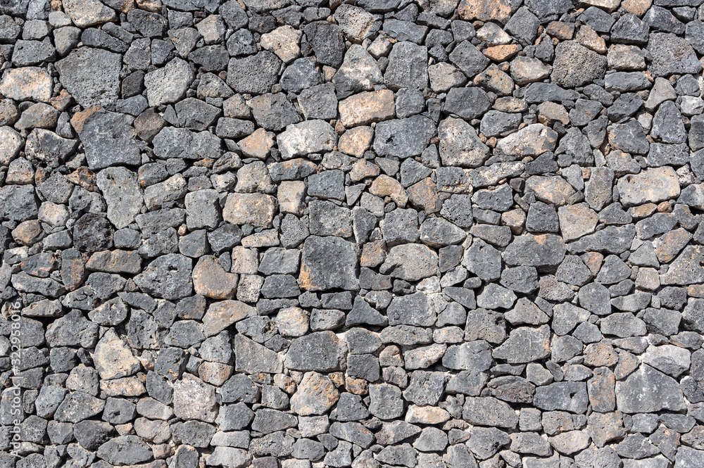 Texture of stone wall made of volcanic rocks Texture of stone wall made of volcanic rocks