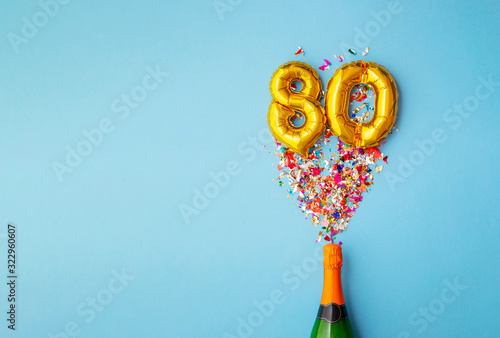 Photos 80th anniversary champagne bottle balloon pop