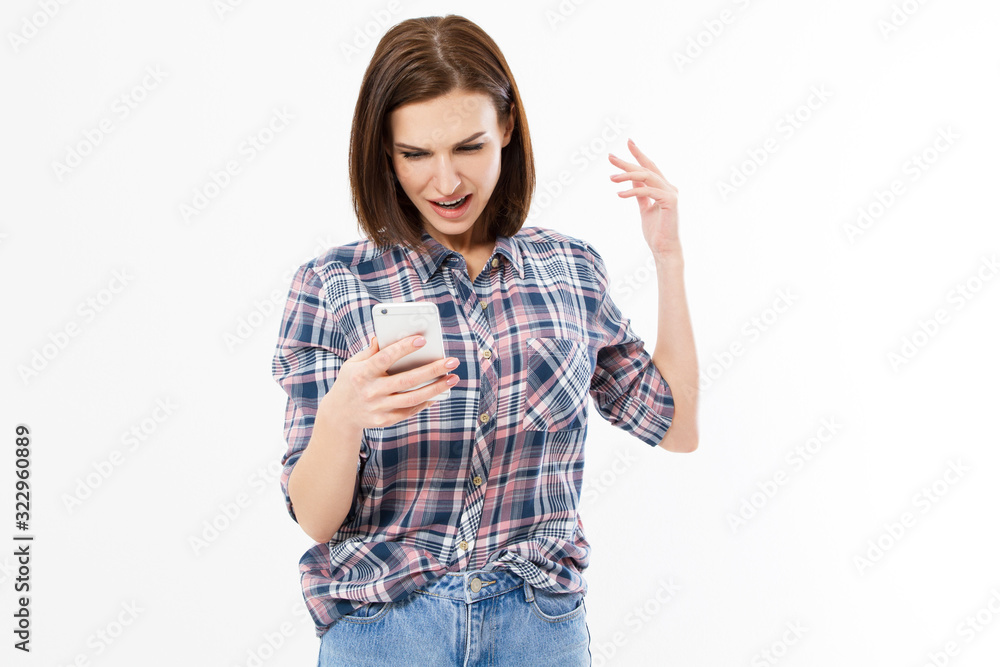 Angry emotional girlisolated on a white background and screaming on the phone Angry emotional girlisolated on a white background and screaming on the phone