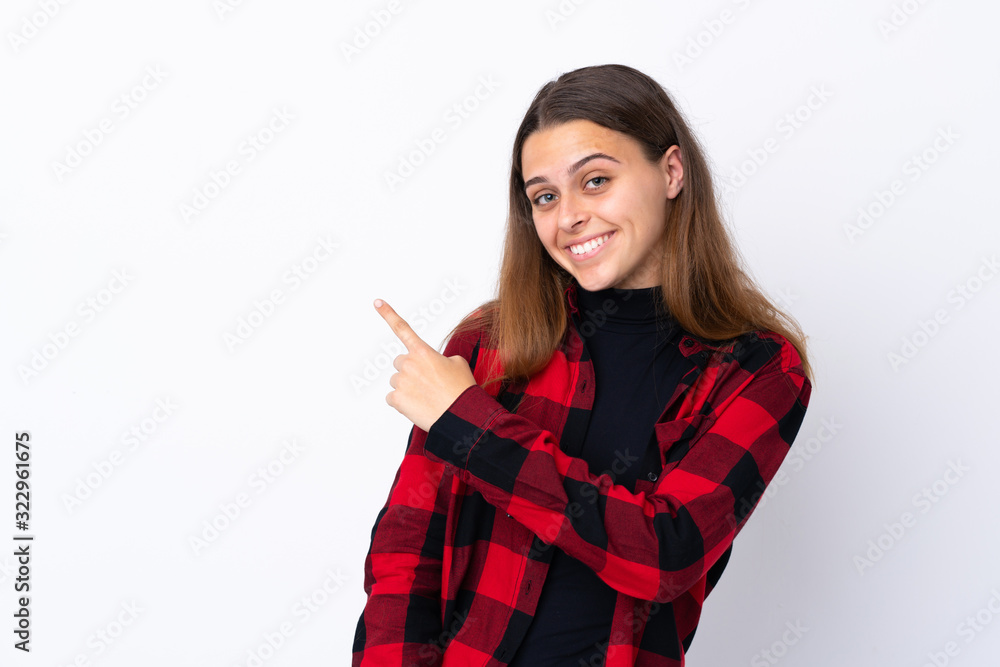 Teenager girl over isolated white background pointing to the side to present a product Teenager girl over isolated white background pointing to the side to present a product