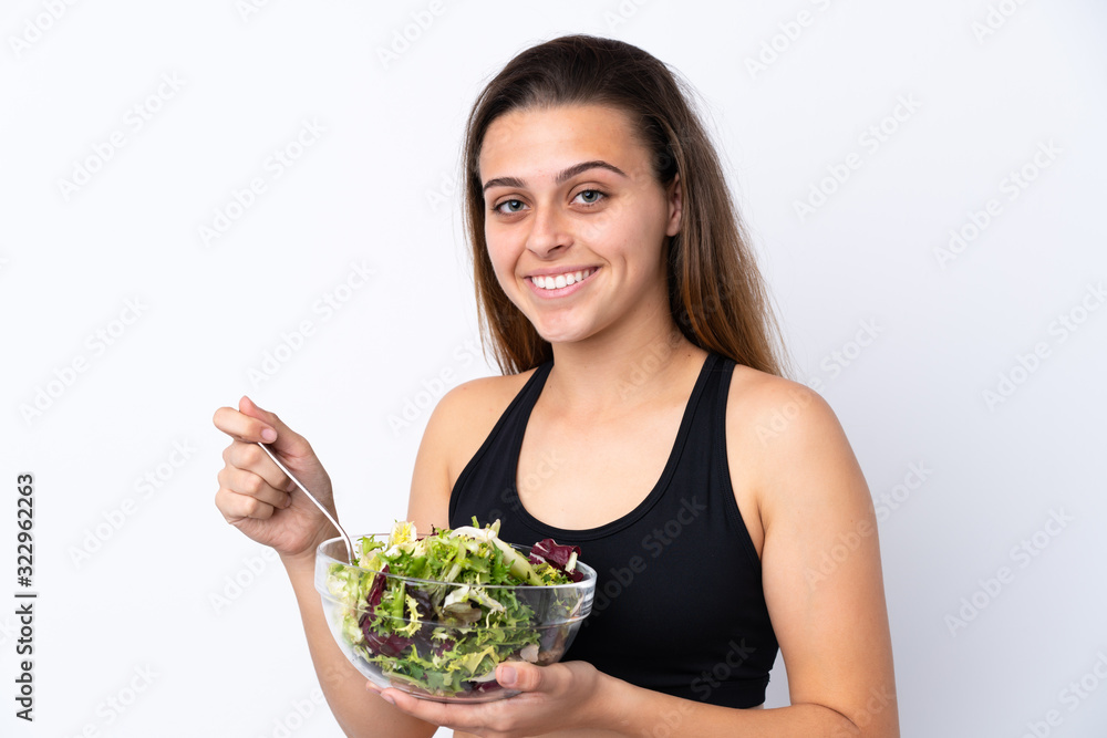 Teenager girl with salad over isolated background Teenager girl with salad over isolated background