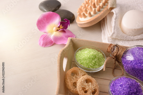 Products for body wellness on wooden tray elevated view