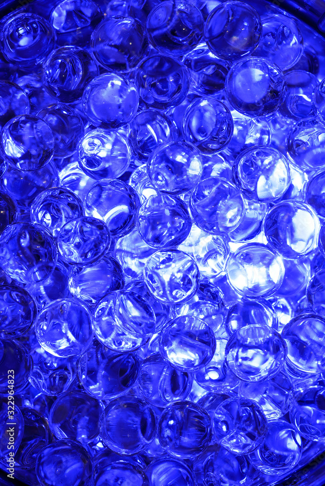 A lot of eggs in the bowl for study and bright blue backlight A lot of eggs in the bowl for study and bright blue backlight