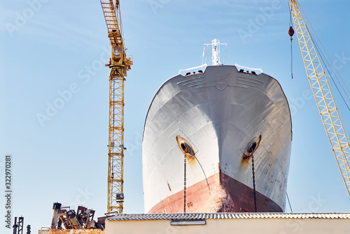 Billede på lærred Ship maintenance industry: Preparation for maintenance works of an old cargo shi