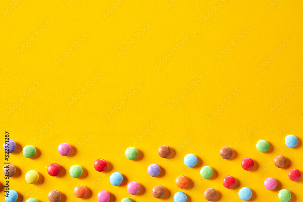 Colorful candy border with sugar-coated chocolate