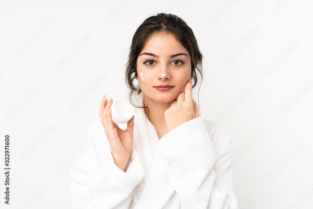 Young caucasian woman isolated on white background with moisturizer Young caucasian woman isolated on white background with moisturizer