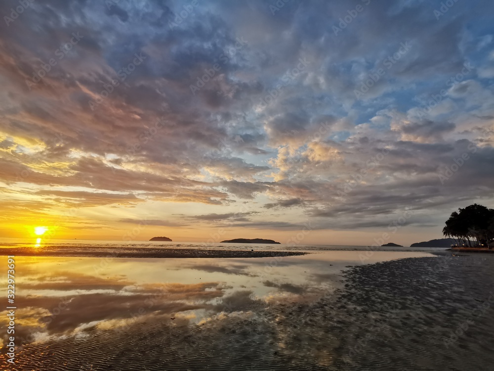 Beautiful Sunset view in Tanjung Aru Beach, Kota Kinabalu. Sabah, Malaysia. Borneo. The Land Below The Wind. Beautiful Sunset view in Tanjung Aru Beach, Kota Kinabalu. Sabah, Malaysia. Borneo. The Land Below The Wind.