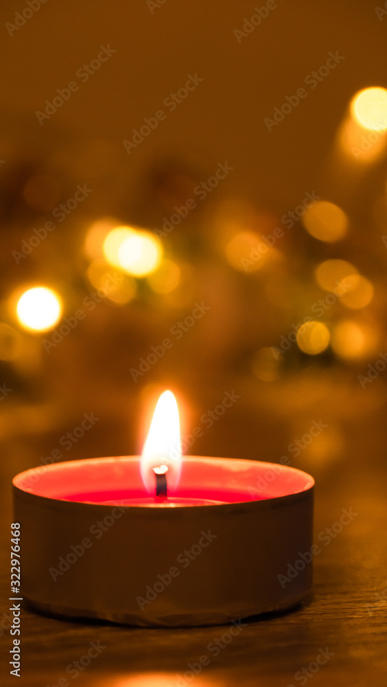 Close up of a burning candle at night; an abstract background of candle Close up of a burning candle at night; an abstract background of candle