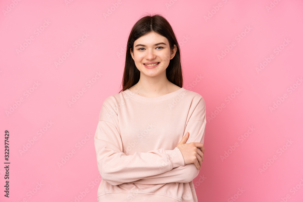 Young Ukrainian teenager girl over isolated pink background keeping the arms crossed in frontal position Young Ukrainian teenager girl over isolated pink background keeping the arms crossed in frontal position