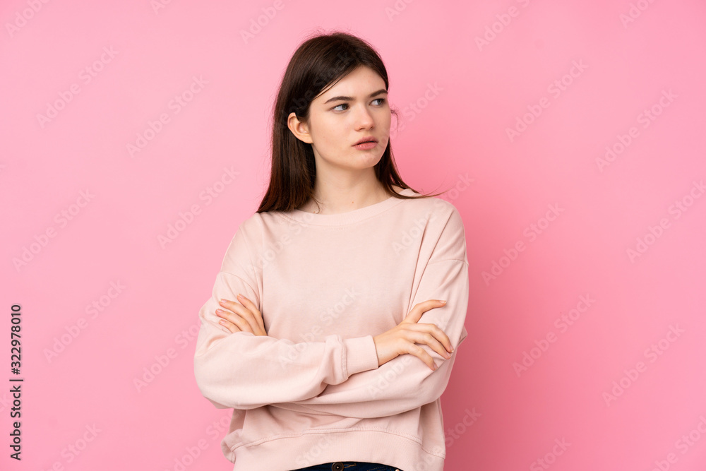 Fototapeta premium Young Ukrainian teenager girl over isolated pink background portrait
