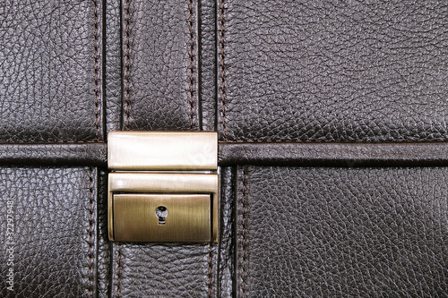 Lock leather briefcase. Skin texture.