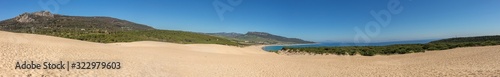 Sunny beach with sand dune, playa de Bolonia, Andalusia, Spain Atlantic coast