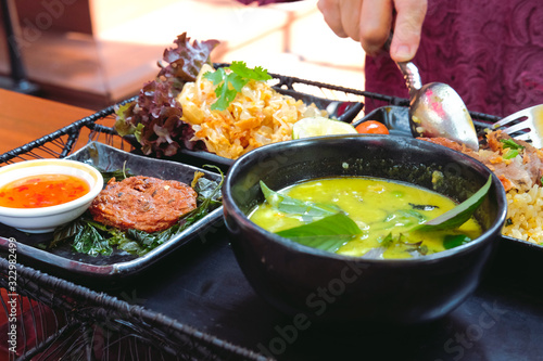 fried fish cake & green curry soup serving with fried rice ฿ sweet & sour pomelo salad