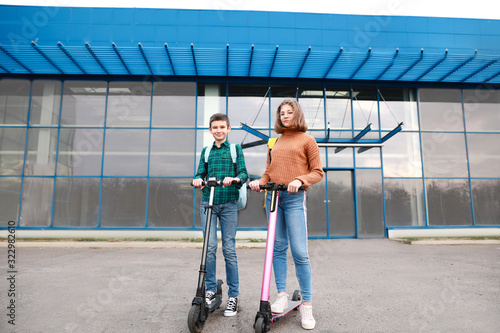 Active teenagers riding kic...
