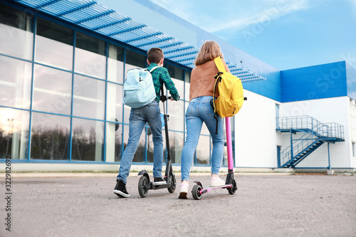 Active teenagers riding kic...