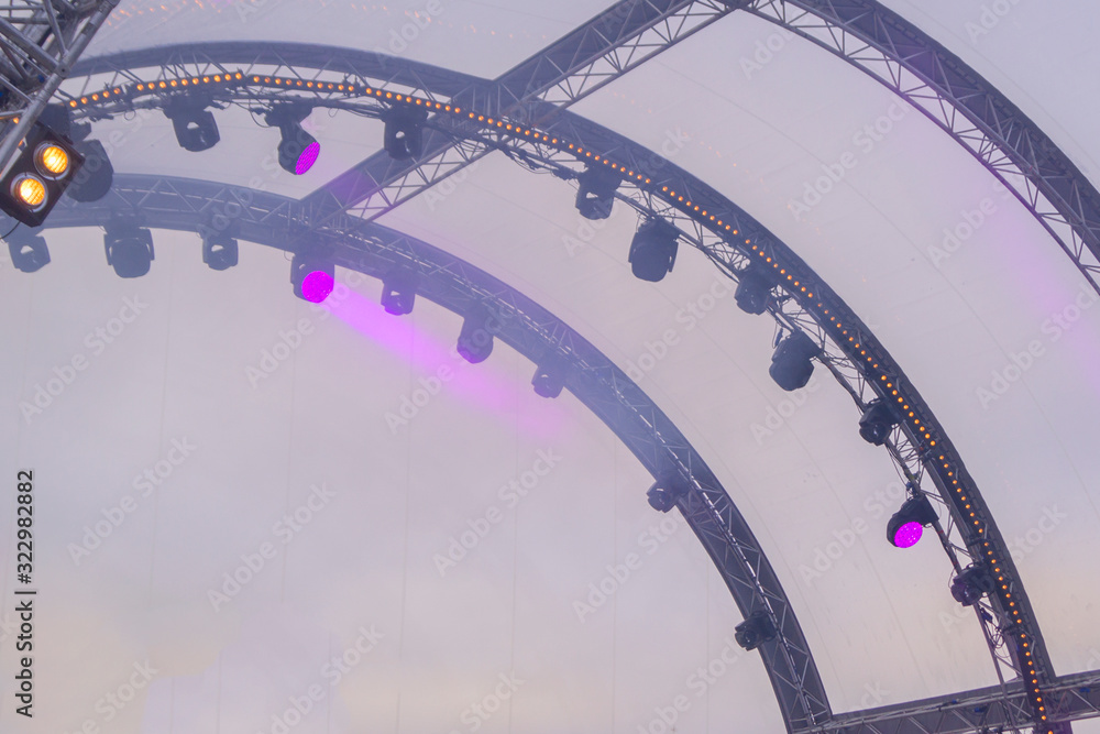 Naklejka premium metal constructions and spotlights on the street stage