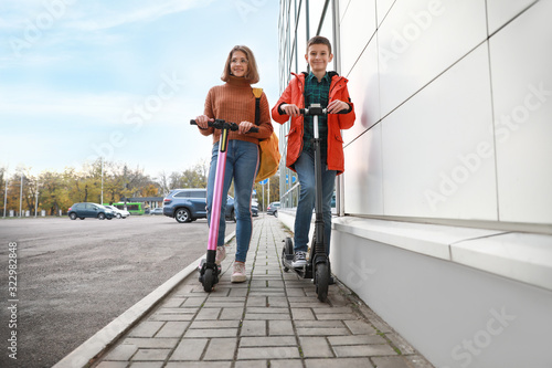 Active teenagers riding kic...