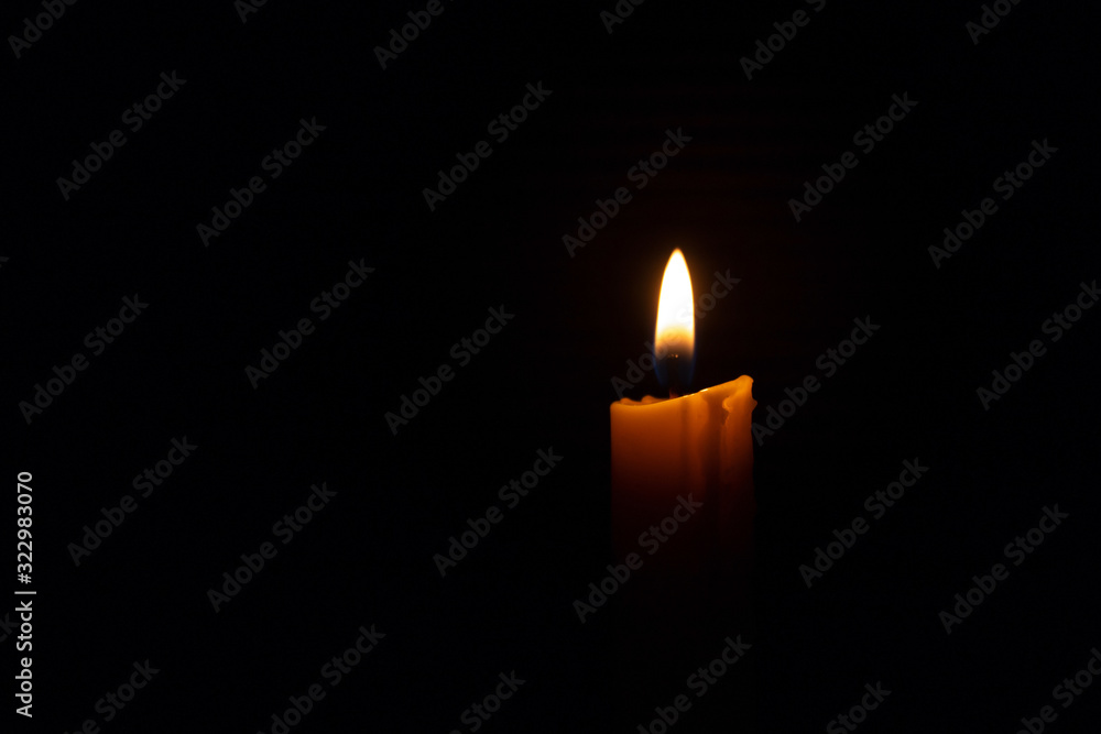 Candles used for religious ceremonies on a black background