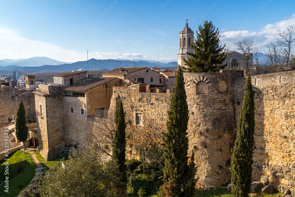 medieval town Gerona with bell tower of Santa Maria cathedral.