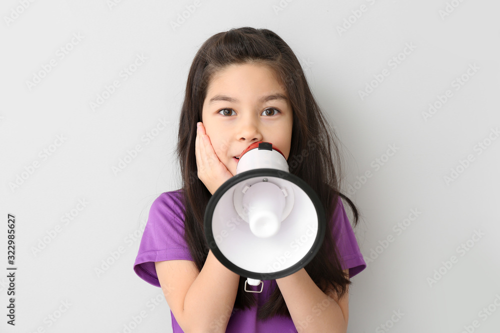 Cute little girl with megaphone on white background Cute little girl with megaphone on white background