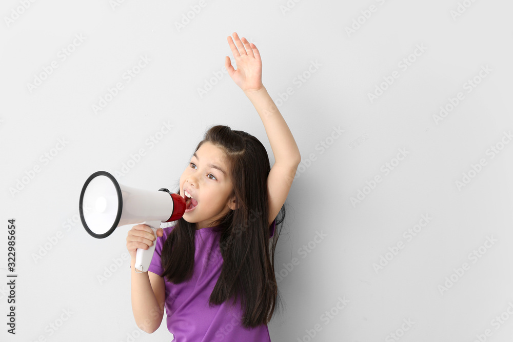 Cute little girl with megaphone on white background Cute little girl with megaphone on white background