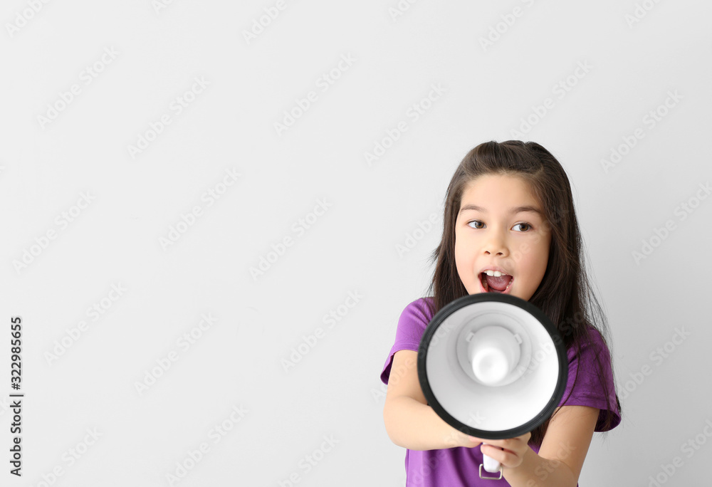 Cute little girl with megaphone on white background Cute little girl with megaphone on white background