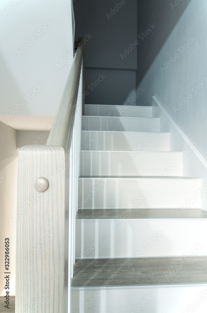 Obraz premium Wooden stylish staircase in the house. Interior.