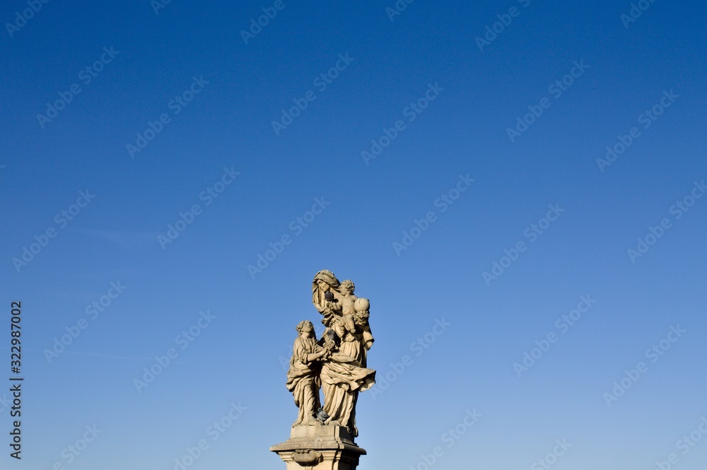 Isolated statue with pigeons in the Charles Bridge (Prague, Czech Republic, Europe)