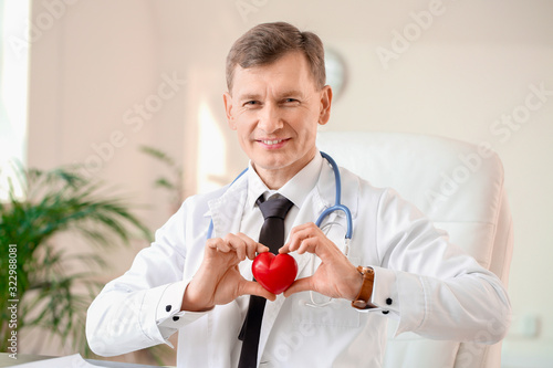 Male cardiologist in modern...