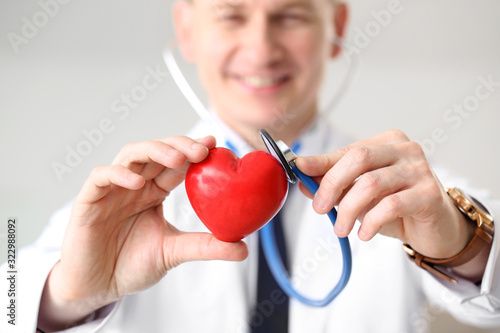 Male cardiologist with red ...