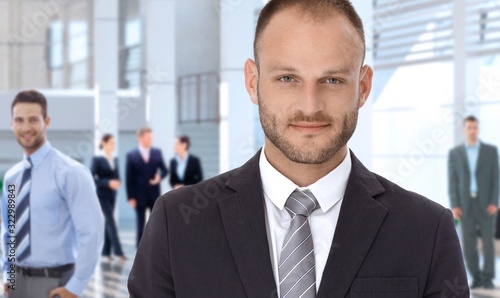 Confident businessman at office lobby