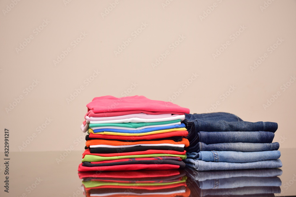 Set of Colorful polo t-shirts and many shades of blue jeans trousers isolated in style light jeans and dark jeans , Fashion trends of denim jean pants, fashion tops concept Set of Colorful polo t-shirts and many shades of blue jeans trousers isolated in style light jeans and dark jeans , Fashion trends of denim jean pants, fashion tops concept