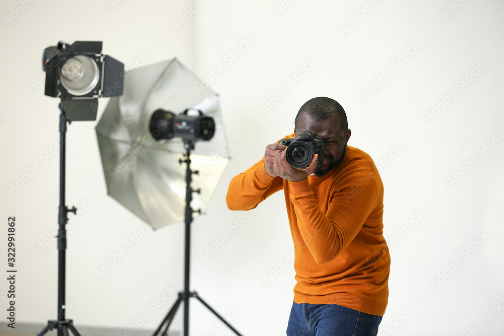 African-American photographer in modern studio African-American photographer in modern studio